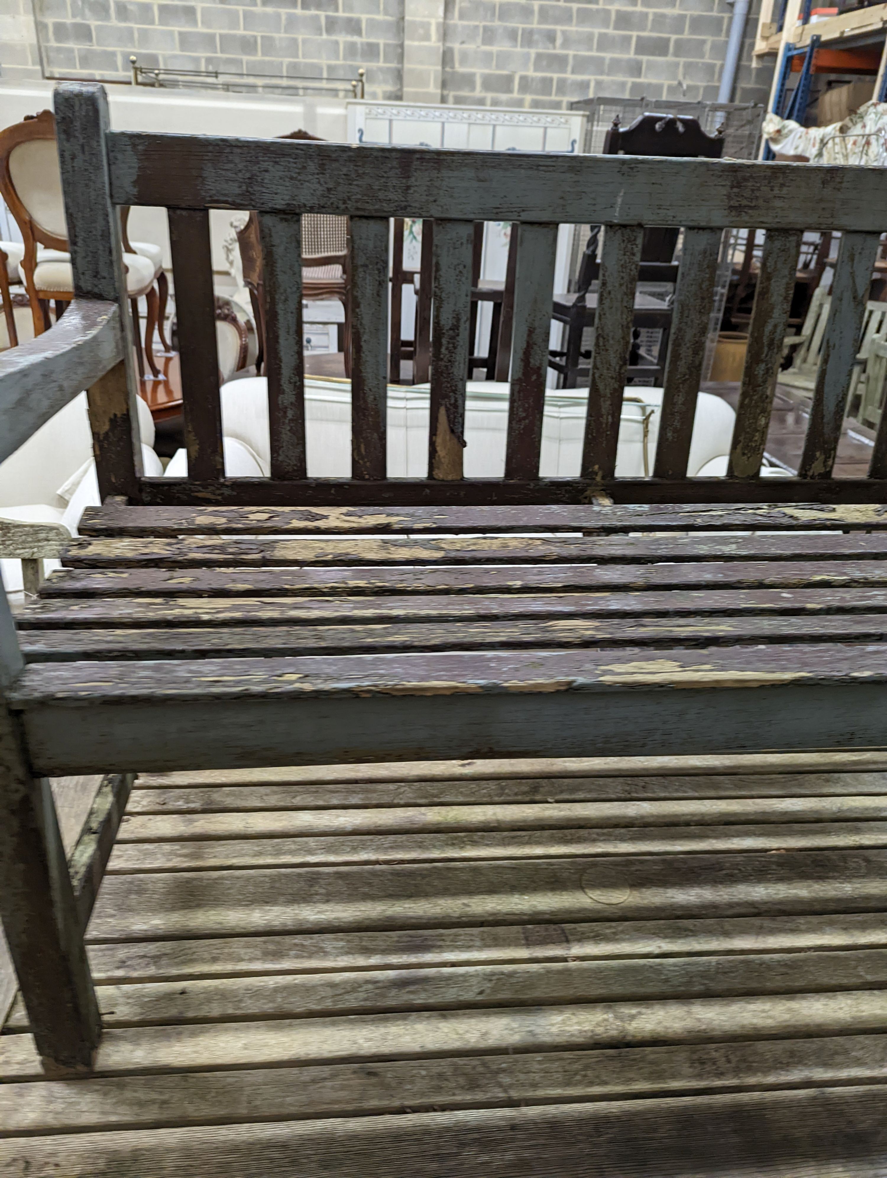 A weathered teak garden bench and rectangular table. Bench - W-122cm, D-54cm, H-83cm. Table - W-149cm, D-70cm, H-74cm.